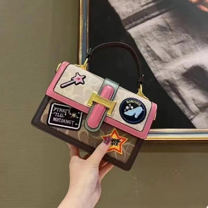 Bolso de dama baúl Caoch Imp de parches